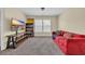 Inviting living room with a plush red sofa, a large screen television, and plenty of natural light at 381 Winslow Ave., Myrtle Beach, SC 29588