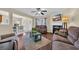 Comfortable living room with fireplace, ceiling fan, and seamless transition to breakfast nook and dining area at 381 Winslow Ave., Myrtle Beach, SC 29588