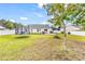 Expansive backyard featuring a fire pit, trampoline, white fence, patio and room for entertaining or outdoor activities at 4008 Scarlet Oak Ct., Myrtle Beach, SC 29579