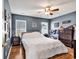 Relaxing bedroom with hardwood floors, fan, and two windows allowing for ample natural light at 4008 Scarlet Oak Ct., Myrtle Beach, SC 29579