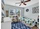 This bedroom has natural light, a ceiling fan, and a playful dinosaur themed comforter, great for children at 4008 Scarlet Oak Ct., Myrtle Beach, SC 29579