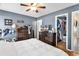 Spacious bedroom featuring hardwood floors, a closet, and dresser and tv for storage and entertainment at 4008 Scarlet Oak Ct., Myrtle Beach, SC 29579