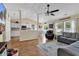 Inviting living area boasts wood flooring, a cozy sofa, and an open layout leading to the kitchen and dining area at 4008 Scarlet Oak Ct., Myrtle Beach, SC 29579