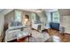 Charming bedroom with two twin beds, hardwood floors, lots of natural light, and vintage furnishings at 402 E Broad St., Hemingway, SC 29554