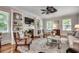 Comfortable living room featuring a fireplace with built-in shelving, neutral tones, and ample natural light at 402 E Broad St., Hemingway, SC 29554