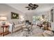 Inviting living room with comfortable seating, a stylish rug, and French doors opening to a serene outdoor view at 402 E Broad St., Hemingway, SC 29554
