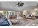 Open living space with neutral colors, tile flooring, dining area, and bright seating area at 402 E Broad St., Hemingway, SC 29554