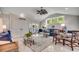 Open living space with neutral colors, tile flooring, dining area, and a bright seating area at 402 E Broad St., Hemingway, SC 29554