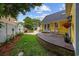 Spacious backyard featuring a wooden deck, patio area, and well-manicured lawn at 4023 Murrells Inlet Rd., Murrells Inlet, SC 29576