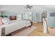 Bright bedroom with access to ensuite bathroom and staircase with wood floors at 4023 Murrells Inlet Rd., Murrells Inlet, SC 29576
