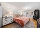 Well-lit bedroom featuring two dressers and a comfortable-looking bed at 4023 Murrells Inlet Rd., Murrells Inlet, SC 29576