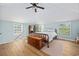 Bright bedroom with a ceiling fan and a large storage chest at the foot of the bed at 4023 Murrells Inlet Rd., Murrells Inlet, SC 29576