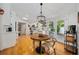 Cozy dining area featuring a rustic table, natural light, and direct access to the outdoor patio at 4023 Murrells Inlet Rd., Murrells Inlet, SC 29576