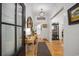 Bright foyer featuring hardwood floors, shiplap walls, and stylish decor at 4023 Murrells Inlet Rd., Murrells Inlet, SC 29576