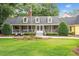 Charming one-story home featuring a welcoming porch and landscaped front yard, perfect for southern relaxation at 4023 Murrells Inlet Rd., Murrells Inlet, SC 29576
