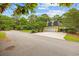 Rear view of property showcasing detached garage and fenced-in yard at 4023 Murrells Inlet Rd., Murrells Inlet, SC 29576