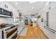 Bright kitchen with modern appliances, farmhouse sink, light countertops, and stainless steel refrigerator at 4023 Murrells Inlet Rd., Murrells Inlet, SC 29576