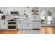 Well-lit kitchen featuring modern appliances, farmhouse sink, and stylish fixtures, creating a modern feel at 4023 Murrells Inlet Rd., Murrells Inlet, SC 29576