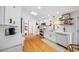 Bright kitchen showcasing modern appliances, light countertops, and custom cabinets with a functional layout at 4023 Murrells Inlet Rd., Murrells Inlet, SC 29576