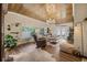 Bright living room with a wooden ceiling, ample seating, and natural light, creating a comfortable space at 4023 Murrells Inlet Rd., Murrells Inlet, SC 29576