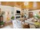 Cozy living room with wood ceiling, fireplace, and inviting seating arrangement at 4023 Murrells Inlet Rd., Murrells Inlet, SC 29576