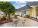 Charming patio with outdoor seating, ideal for enjoying the tranquil surroundings of the backyard at 4023 Murrells Inlet Rd., Murrells Inlet, SC 29576