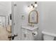 Well-lit bathroom with marble countertop and gold accents at 4206 S Ocean Blvd., North Myrtle Beach, SC 29582