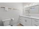 Bright bathroom features marble countertops, gold fixtures and a large mirror at 4206 S Ocean Blvd., North Myrtle Beach, SC 29582