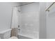 Clean bathroom design with white shower-tub combo and light blue walls at 4206 S Ocean Blvd., North Myrtle Beach, SC 29582