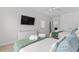Comfortable bedroom featuring two beds, soft linens, and a dresser with a TV at 4206 S Ocean Blvd., North Myrtle Beach, SC 29582