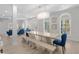 Bright dining area with light wood table, seating, and stylish chandelier at 4206 S Ocean Blvd., North Myrtle Beach, SC 29582
