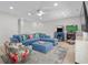 Cozy living room with a blue sectional sofa and arcade games for Gathering entertainment at 4206 S Ocean Blvd., North Myrtle Beach, SC 29582