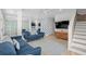 Spacious living room with stylish furniture, TV, and adjoining dining area at 4206 S Ocean Blvd., North Myrtle Beach, SC 29582