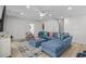 Spacious living room featuring a comfortable sectional sofa, ottoman, and a flat-screen TV at 4206 S Ocean Blvd., North Myrtle Beach, SC 29582
