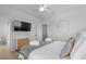 Serene main bedroom with a comfortable bed, white linens, and a flat screen TV at 4206 S Ocean Blvd., North Myrtle Beach, SC 29582