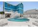 Beautiful private pool and spa area, surrounded by lounge chairs and lush landscaping at 4206 S Ocean Blvd., North Myrtle Beach, SC 29582