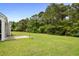 Expansive backyard with lush green lawn and wooded area, perfect for outdoor activities at 4246 Livorn Loop, Myrtle Beach, SC 29579