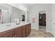 Bathroom with double vanity sinks, a walk-in shower, and access to a walk-in closet at 4246 Livorn Loop, Myrtle Beach, SC 29579