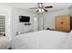 Well-lit bedroom with neutral walls, carpet, a bed and a ceiling fan at 4246 Livorn Loop, Myrtle Beach, SC 29579