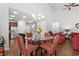 Bright dining area adjacent to the kitchen with a glass-top table and seating for four at 4246 Livorn Loop, Myrtle Beach, SC 29579