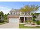 Charming two-story home with a brick facade, landscaped yard, and a two-car garage at 4246 Livorn Loop, Myrtle Beach, SC 29579