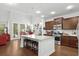 Spacious kitchen with granite countertops, stainless steel appliances, and an island with barstool seating at 4246 Livorn Loop, Myrtle Beach, SC 29579