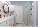 Well-lit bathroom featuring a glass shower, vanity, and a decorative mirror at 428 Calhoun Falls Dr., Myrtle Beach, SC 29579