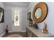 Entryway with wood-look flooring, decorative mirror, and unique decor at 428 Calhoun Falls Dr., Myrtle Beach, SC 29579