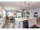 Open-concept kitchen with stainless appliances and view of the dining and living areas at 428 Calhoun Falls Dr., Myrtle Beach, SC 29579