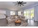Bright open-concept living room with modern furnishings and access to back patio at 428 Calhoun Falls Dr., Myrtle Beach, SC 29579