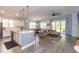Open-concept living area with modern decor, lots of light, and a kitchen island at 428 Calhoun Falls Dr., Myrtle Beach, SC 29579