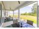 Relaxing covered patio featuring comfortable seating and a view of the expansive backyard at 428 Calhoun Falls Dr., Myrtle Beach, SC 29579