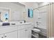 Bright bathroom with a white vanity with storage, a framed mirror, and a shower-tub combination with a white shower curtain at 432 Falling Leaf Loop, Myrtle Beach, SC 29588
