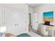 Comfortable bedroom with large closet and a desk area with sunny beach artwork at 432 Falling Leaf Loop, Myrtle Beach, SC 29588